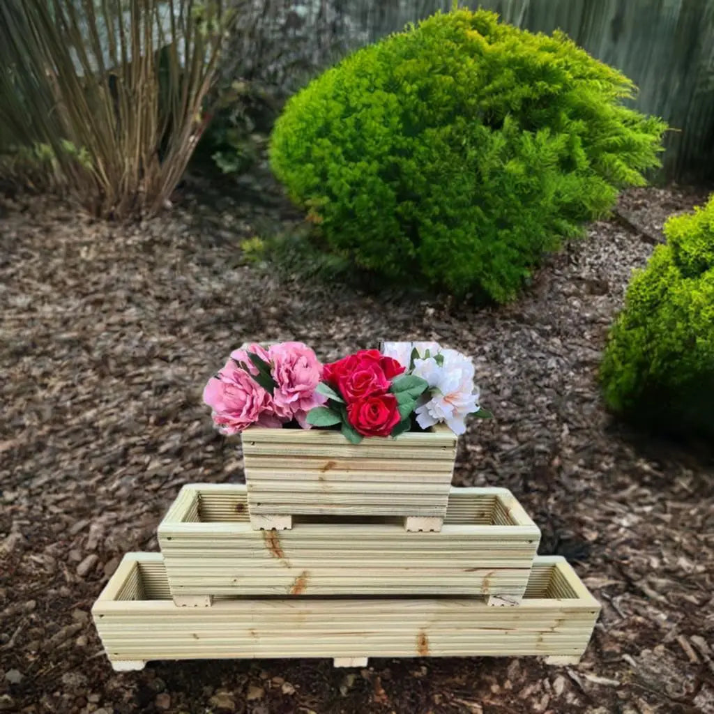 wooden decking planters on bark with bushes 